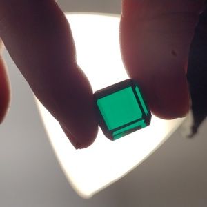 55.85 Ct cube cut Dark Green Emerald